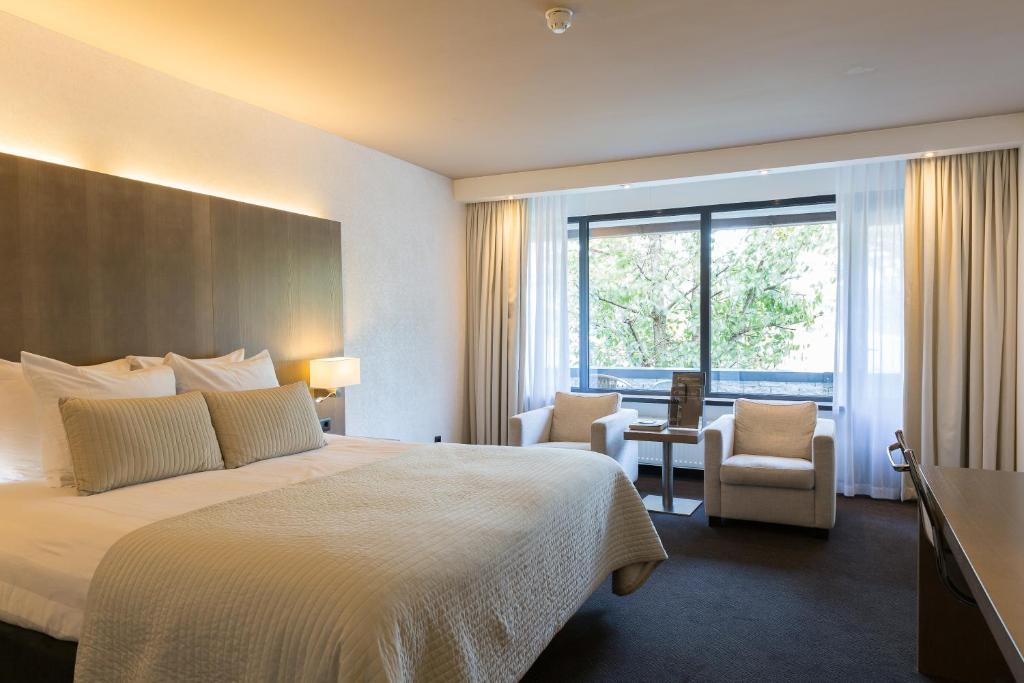 Postel nebo postele na pokoji v ubytování Van der Valk Hotel de Bilt-Utrecht