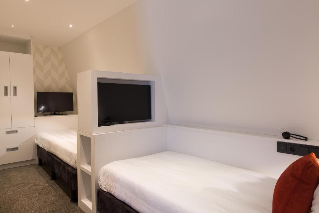 Postel nebo postele na pokoji v ubytování Van der Valk Hotel de Bilt-Utrecht