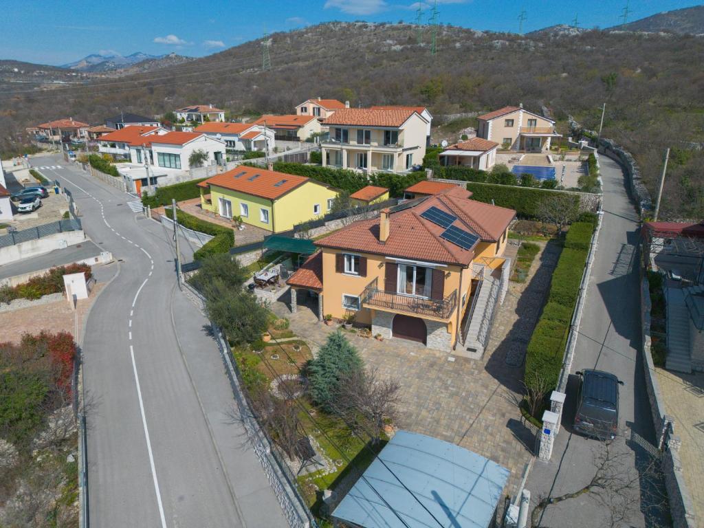 an aerial view of a town with houses and a road at Emma in Krasica