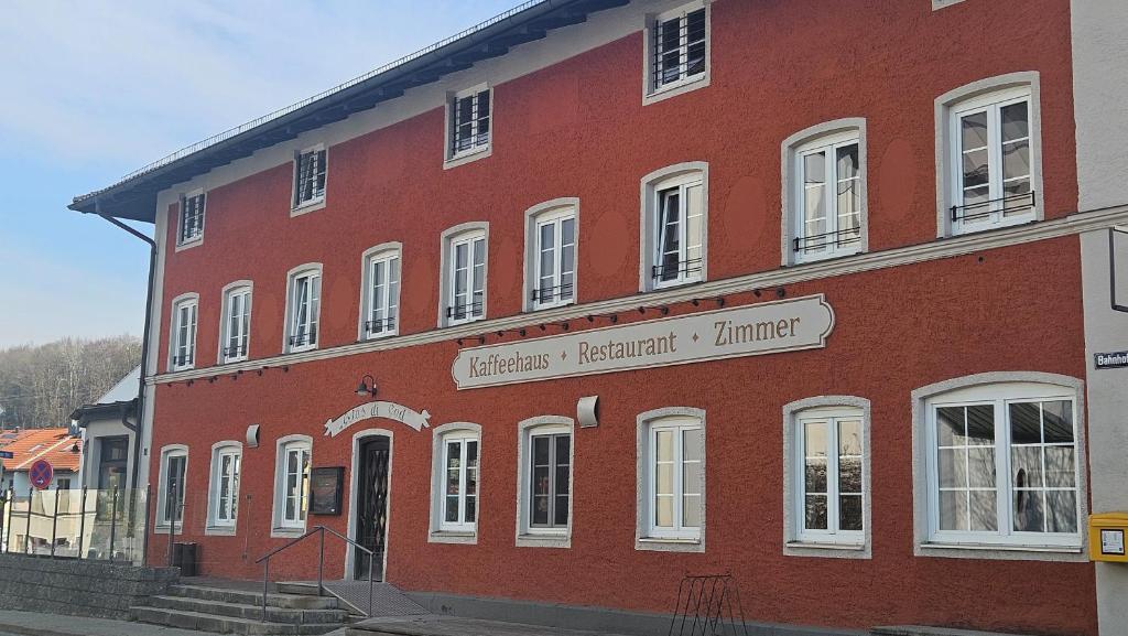 a large red brick building with a sign on it at Endorfer Stubn in Bad Endorf