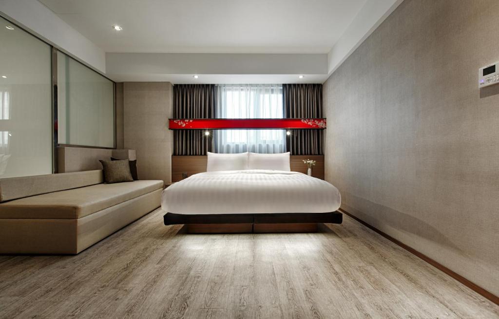 Postel nebo postele na pokoji v ubytování City Place Hotel