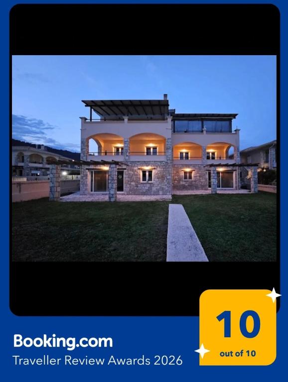 a picture of a large house with the number at Viggas Relaxation Nafpaktos in Nafpaktos