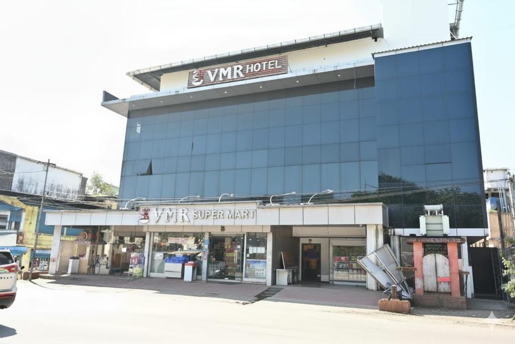 a building with a sign that reads win hotel at VMR Hotel Port Blair in Jangli Ghāt