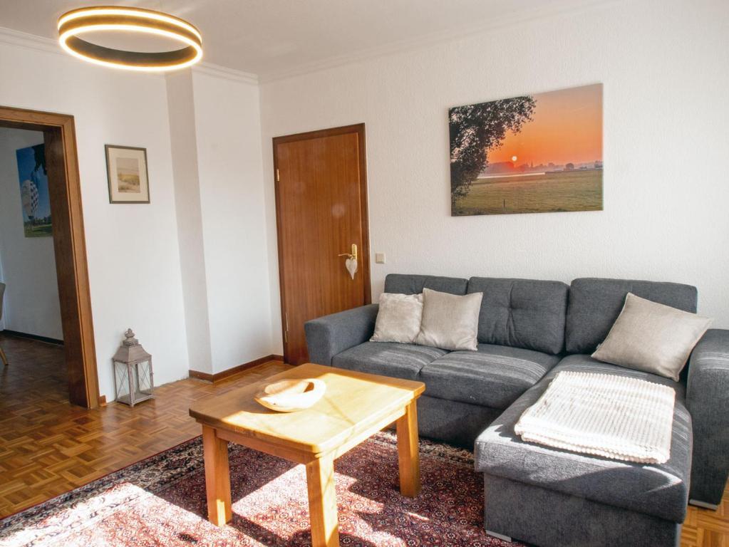 a living room with a couch and a coffee table at Xantenglück in Xanten