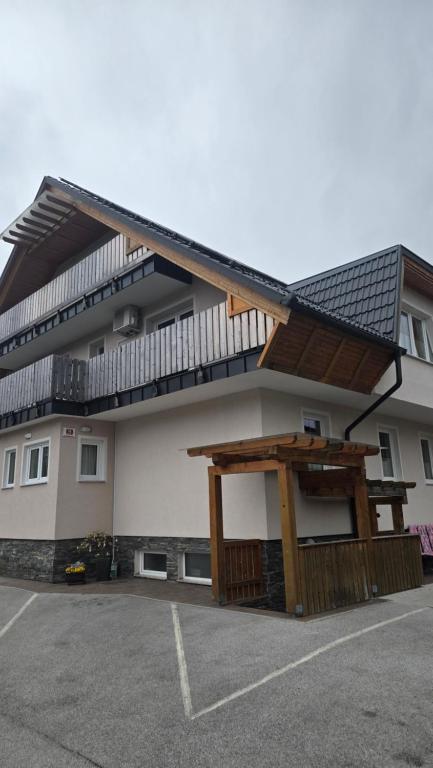 a building with a balcony on the side of it at Vila Rajska ptica in Bled
