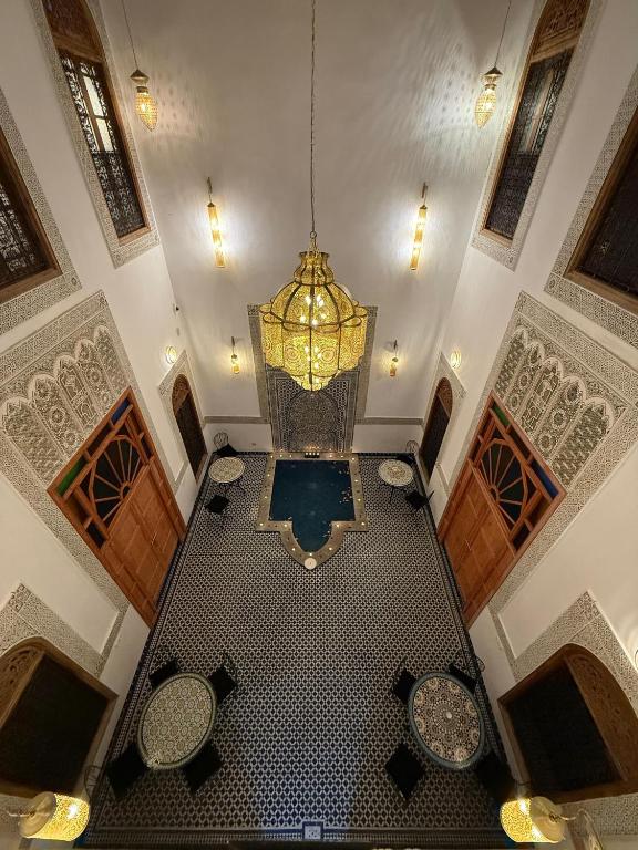 an overhead view of a large room with a chandelier at Riad Mira in Fez