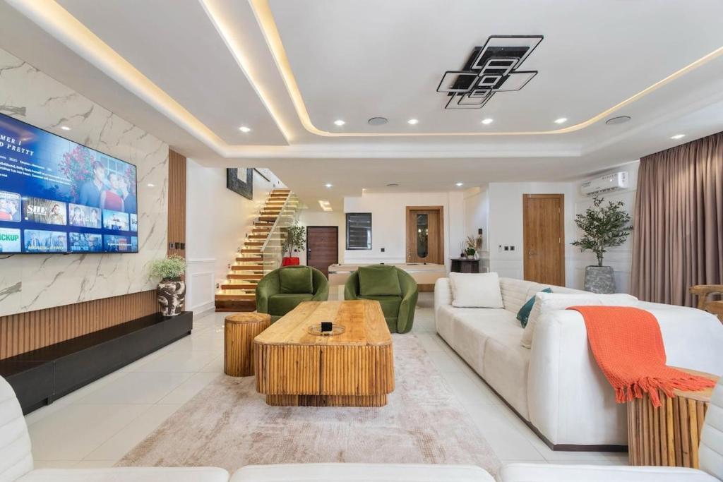 a living room with a couch and a table at Saka in Lekki