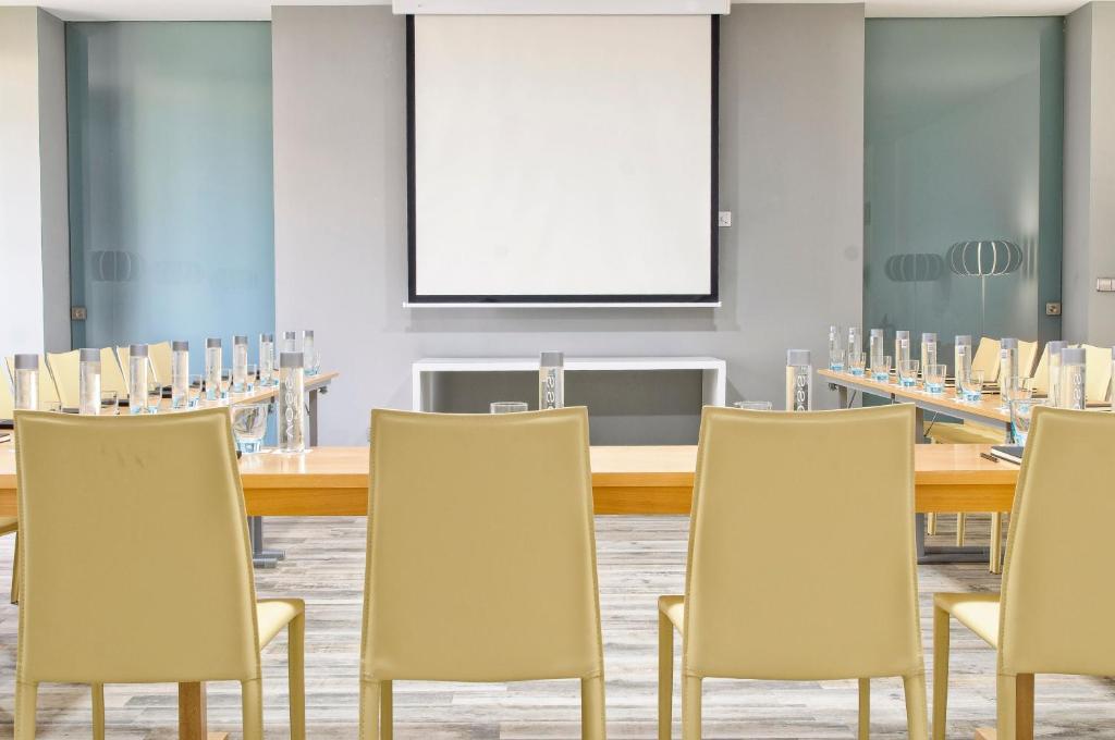 a conference room with a long table and chairs at Barceló Teguise Beach - Adults Only in Costa Teguise
