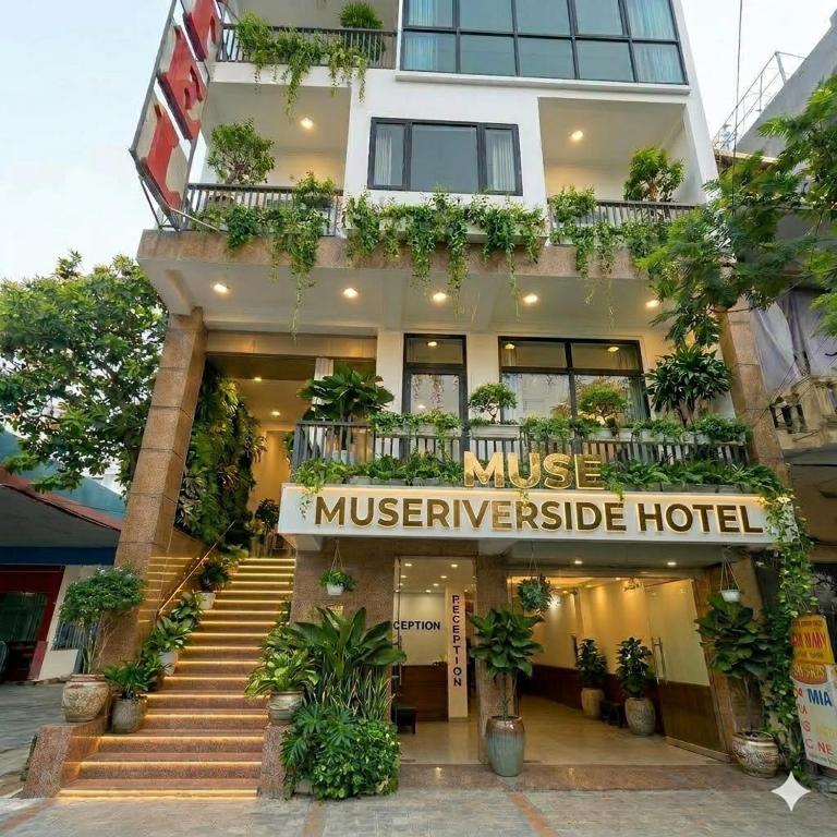 a hotel with a staircase in front of it at Muse Riverside in Ninh Binh