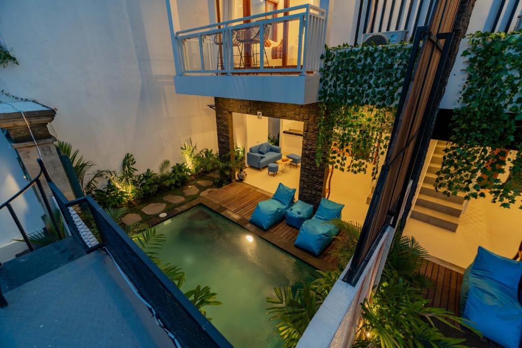 an overhead view of a swimming pool in a house at Cahya Restu Ubud Villa in Ubud
