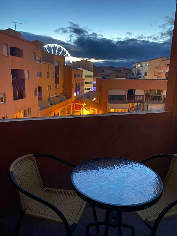 a table and chairs on a balcony with a view at Appartement Cap D'Agde in Cap d'Agde