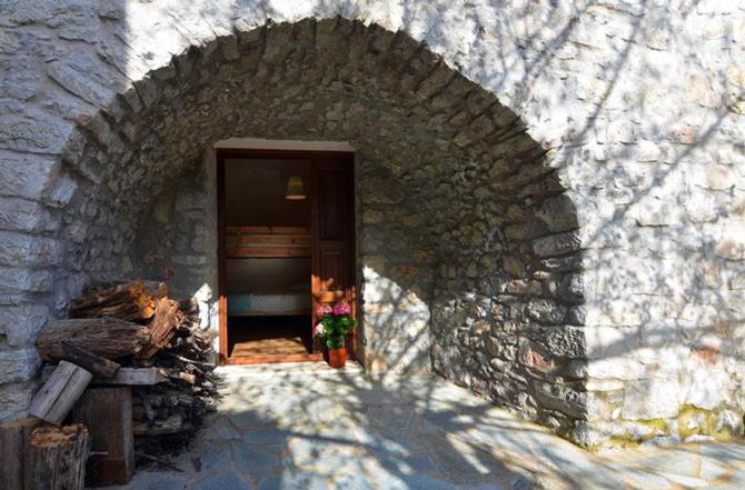an entrance to a stone building with a doorway at Ilia House Altomira in Altomirá