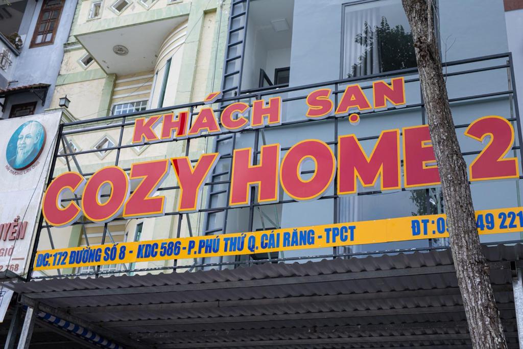 a sign for a cozy home on a building at Khách sạn Cozy Home 2 in Can Tho