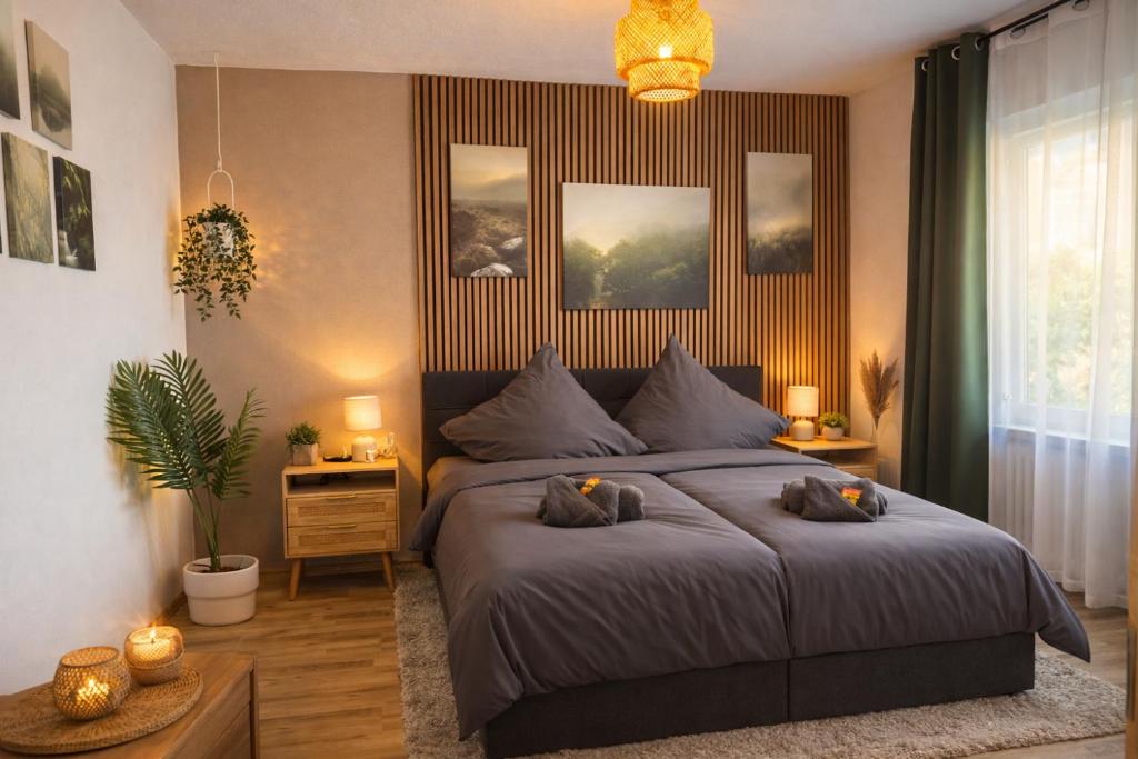 a bedroom with a bed with two pillows on it at Ringdays Guesthouse in Müllenbach
