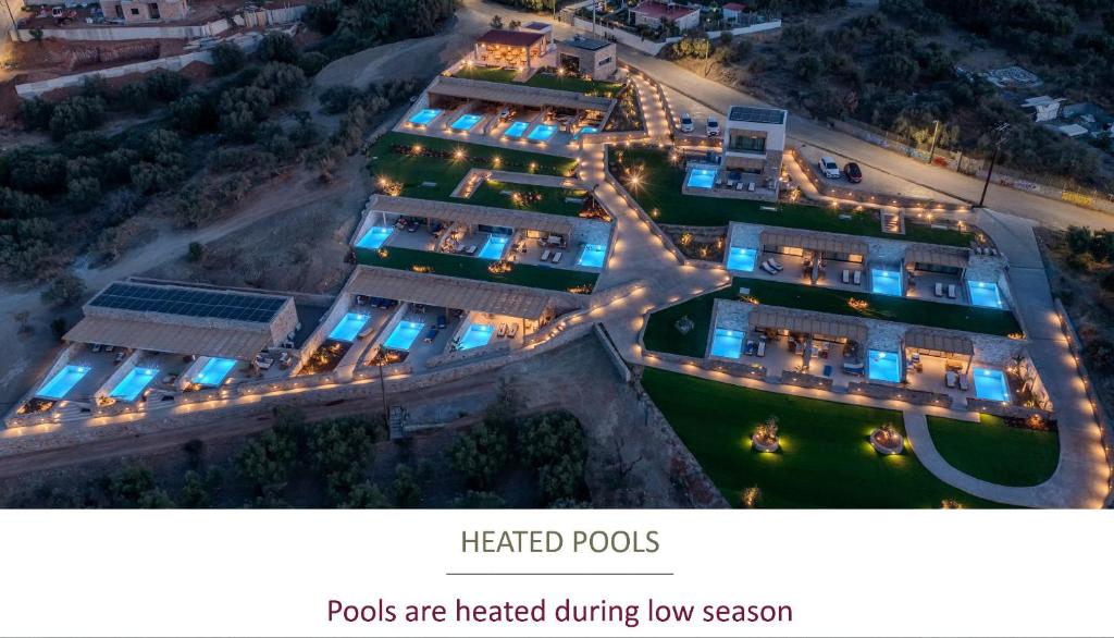 a picture of a resort at night with lights at Deos Luxury Suites - Adults Only in Hersonissos