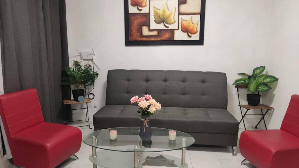 a living room with a couch and a glass table at Casa completa en Puente Moreno Ver in Playa de Vacas