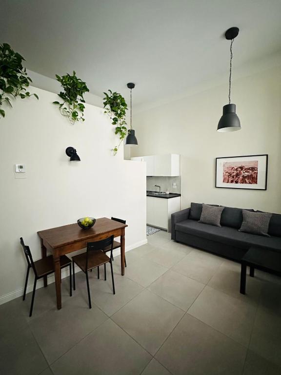 a living room with a couch and a table at Casa Politi in Parma