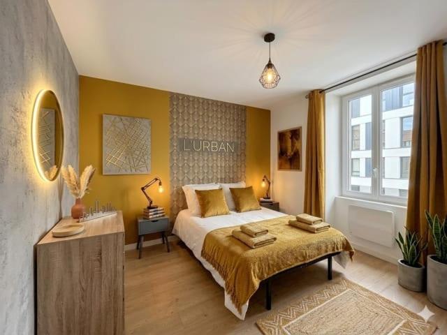 a bedroom with a large bed and a large window at 8C - L'Urban in Saint-Rambert-dʼAlbon