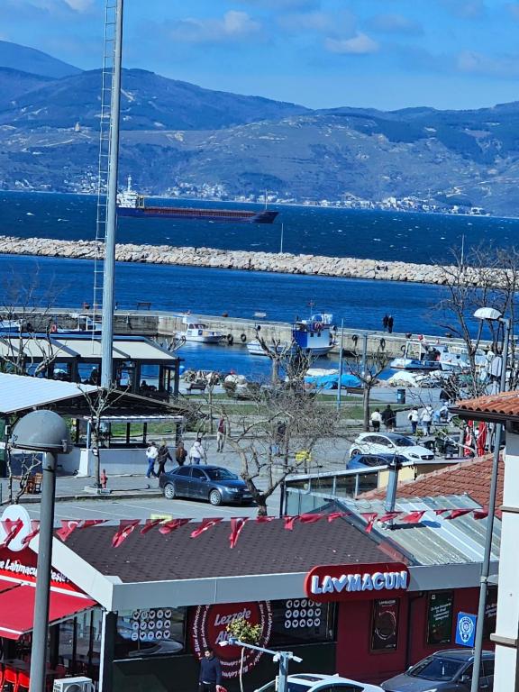 a view of a city with a harbor and the ocean at Royal Konaklama Manzara in Bandırma
