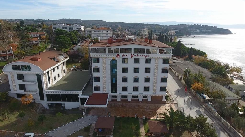 an aerial view of a white building next to the water at Yelkenkaya Otel in Gebze
