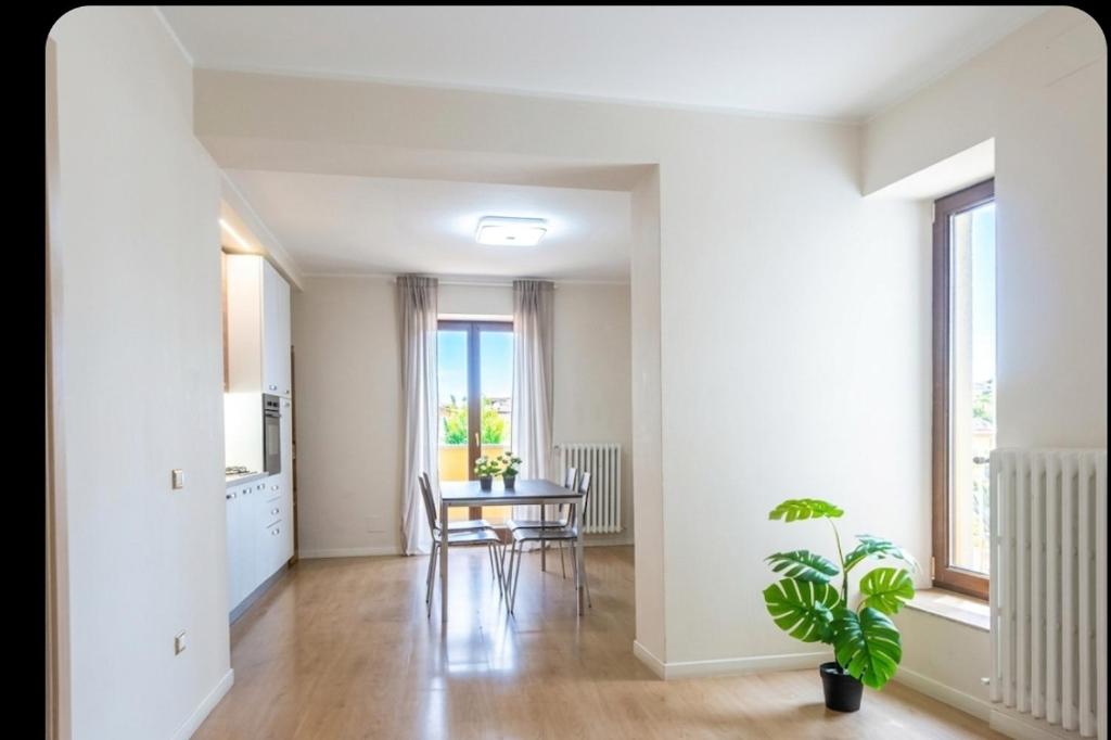 an empty living room with a table and chairs at Casa D&C in Avigliano