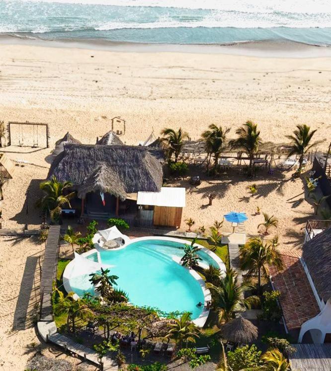 an overhead view of a swimming pool on the beach at Casa Laud playa ventura Boutique hotel in Playa Ventura