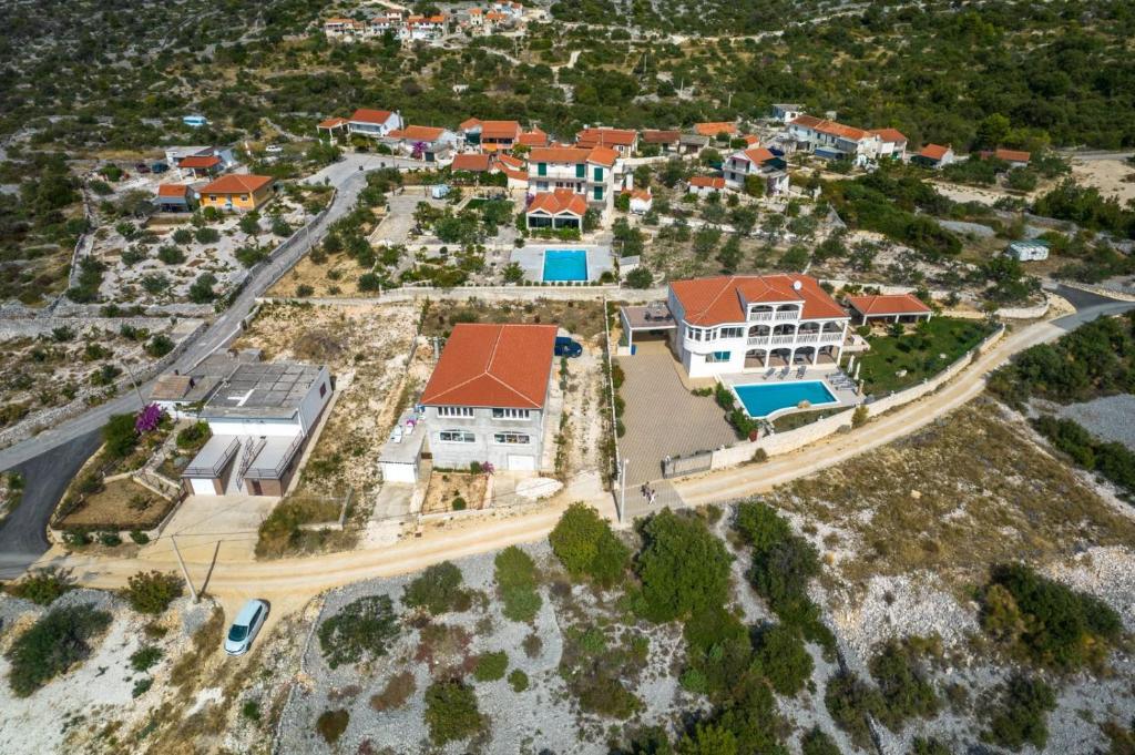 an aerial view of a house on the beach at holiday home V in Donji Seget