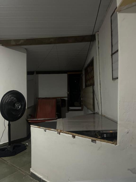 an empty room with a table in a room at Paradise in Natal