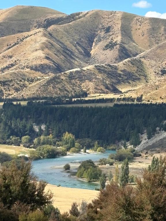 a view of a river with mountains in the background at River and Mountain Central in Queensberry