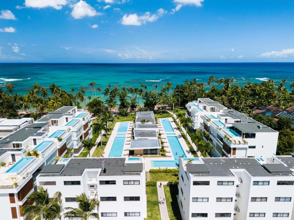 an aerial view of a resort with the ocean in the background at Sol de Arena Beachfront Condos by Bocobay in Las Terrenas