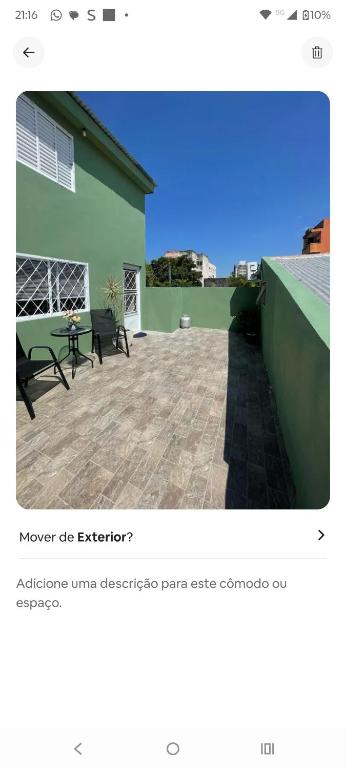 a screenshot of a website of a patio with benches at Condomínio Central Sobradinho in Uruguaiana