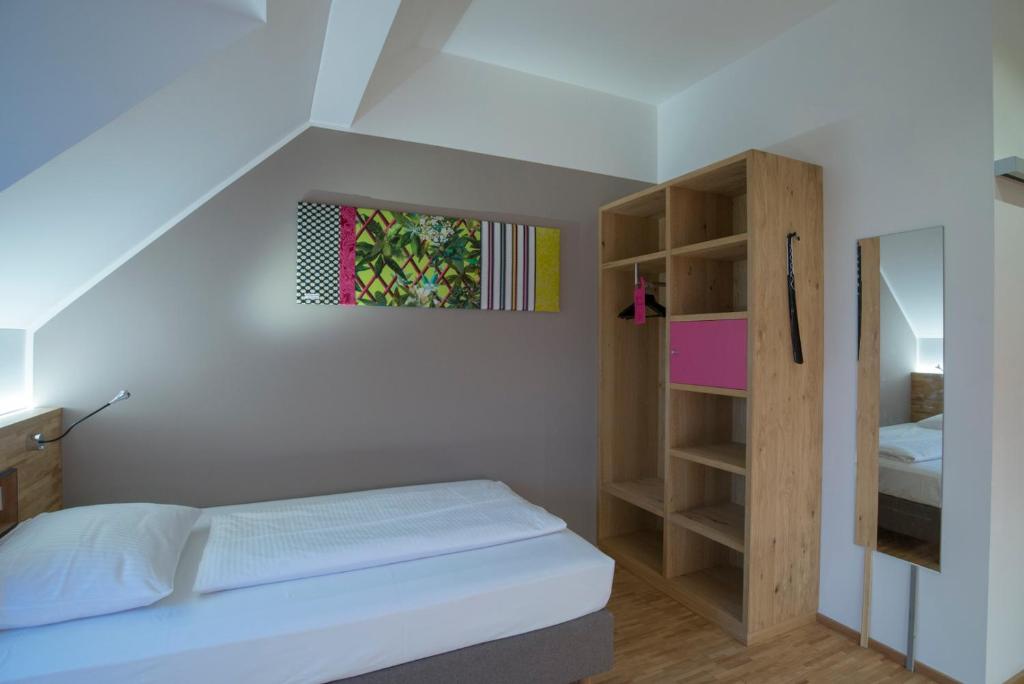 Postel nebo postele na pokoji v ubytování fab Hotel