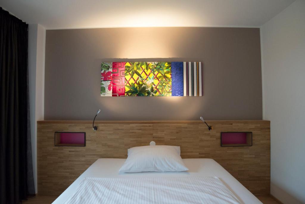 Postel nebo postele na pokoji v ubytování fab Hotel