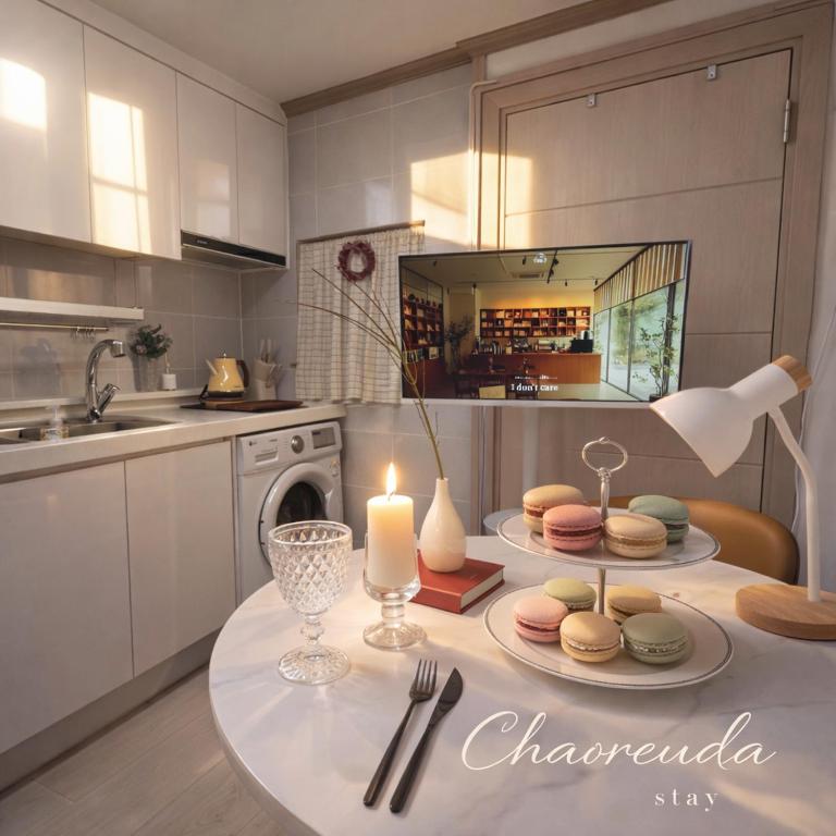 a kitchen with a table with a candle on it at 건대역5분 성수 감성숙소 5 min walk to Konkok Univ Station # 6-Minute Walk to Airport Limousine # Seongsu Cafe Street Walking Tour Hotspots & Pop-up Stores #Seoul Forest # Thukseom Han River Park #KSPO # COEX #Gangnam in Seoul
