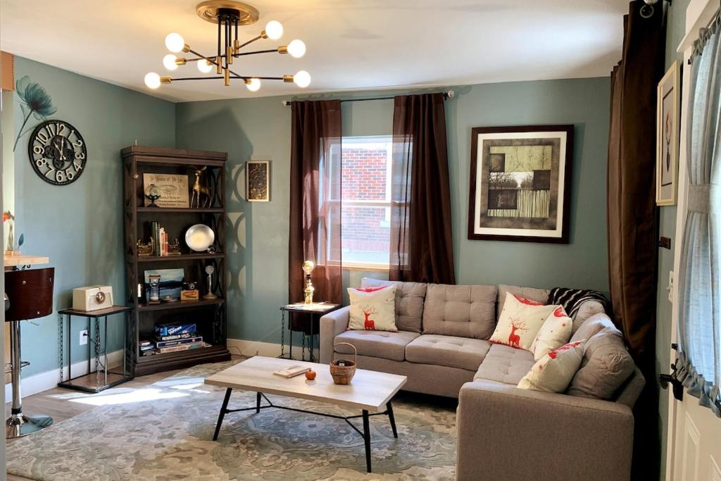 a living room with a couch and a coffee table at Poppy's Place in Chanute