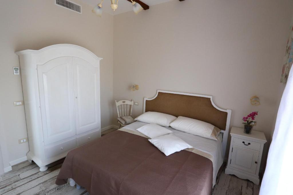 Postel nebo postele na pokoji v ubytování Ambrosio Relais