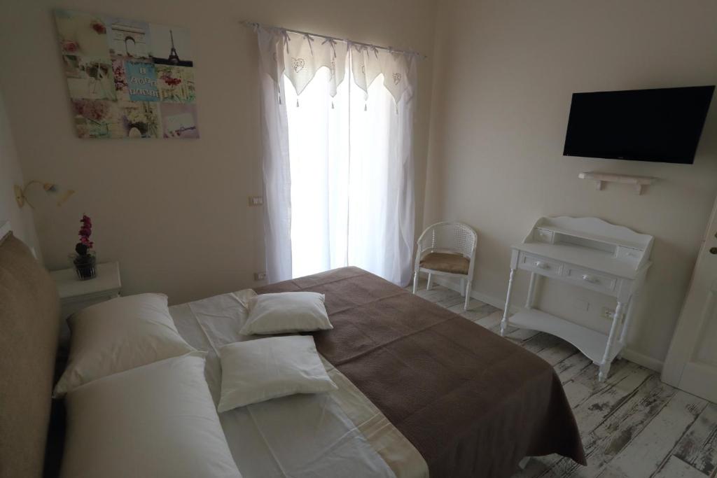 Postel nebo postele na pokoji v ubytování Ambrosio Relais