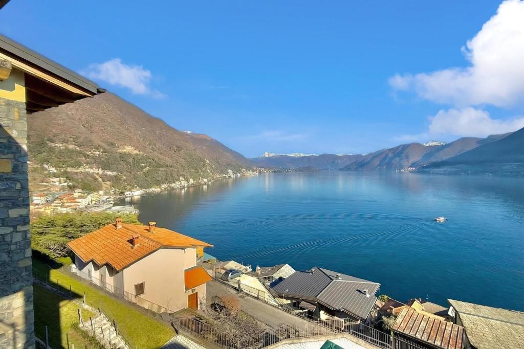 a view of a large body of water with mountains at Residence degli Oleandri 4B in Argegno
