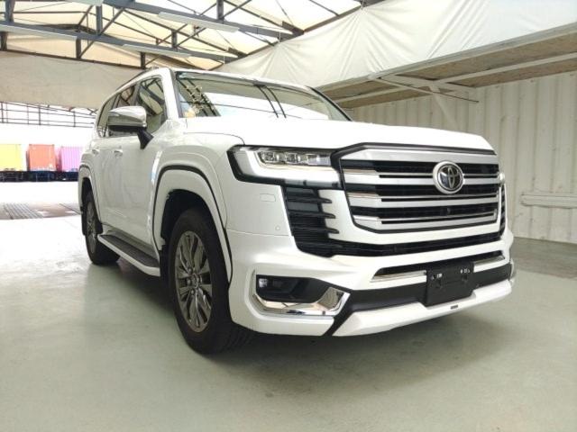 a white truck is parked in a garage at Rabbit Car Safari in Dar es Salaam
