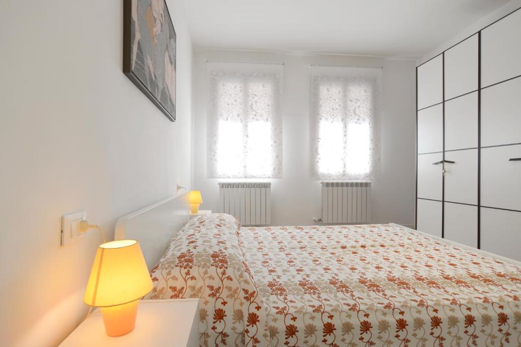 Posteľ alebo postele v izbe v ubytovaní Venice Murano Flat