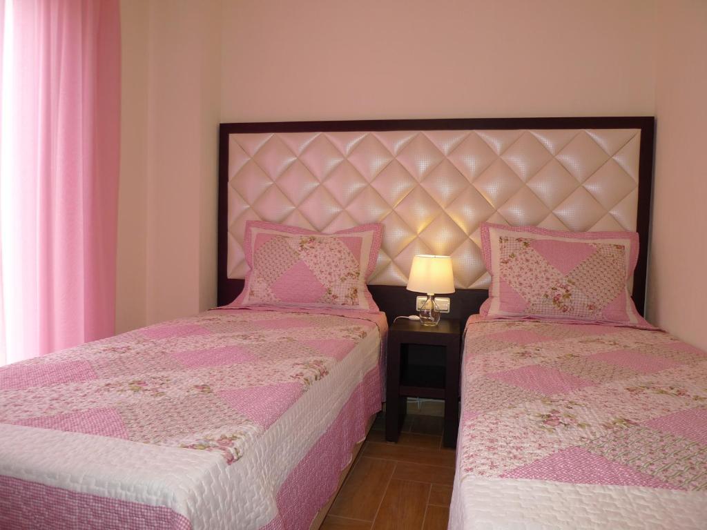 Postel nebo postele na pokoji v ubytování Excellent Villa