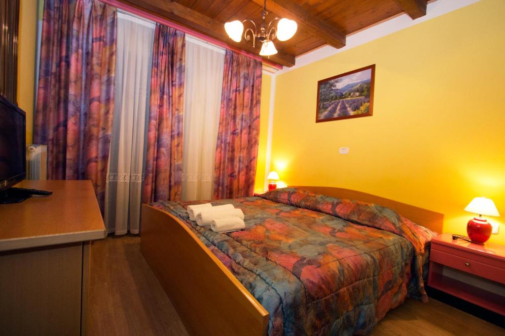 Postel nebo postele na pokoji v ubytování Tourist Farm Gregorič