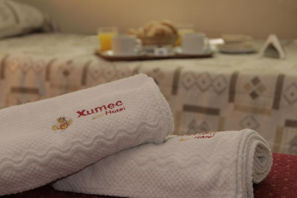 Postel nebo postele na pokoji v ubytování Hotel Xumec Mendoza