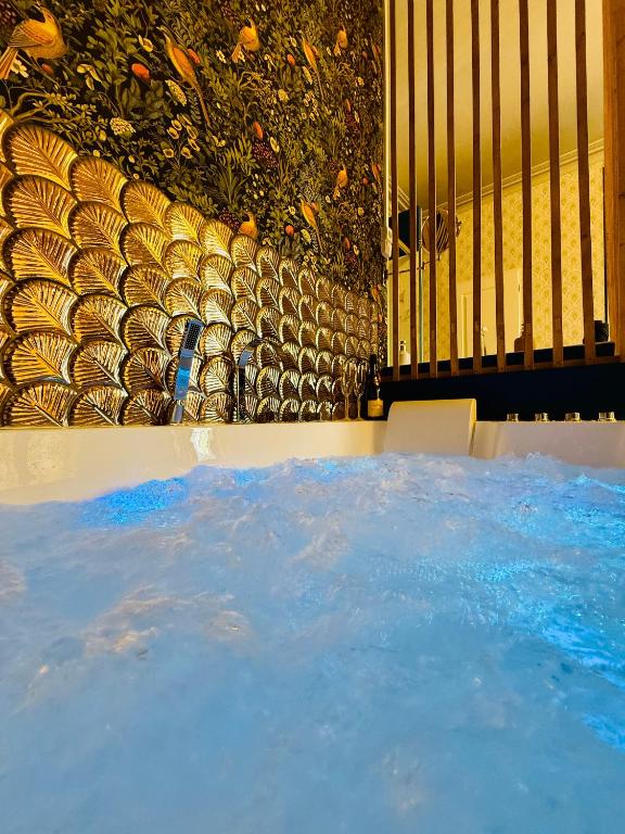 a pool of water in front of a fence at Appartement Haussmann Spa et Ciné Experience in Nîmes