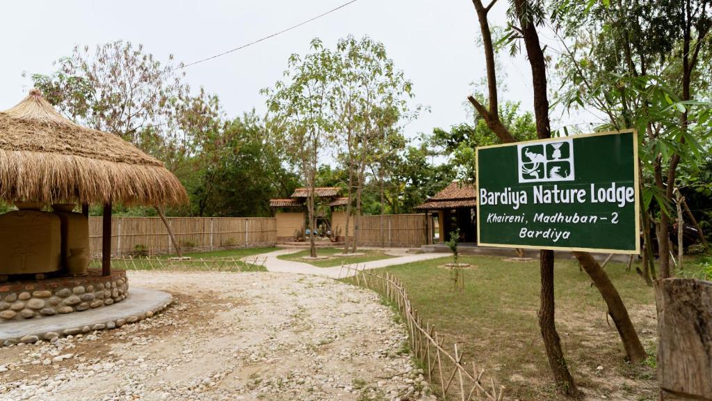 a sign for a reptile nature lodge at a zoo at Bardiya Nature Lodge in Belā