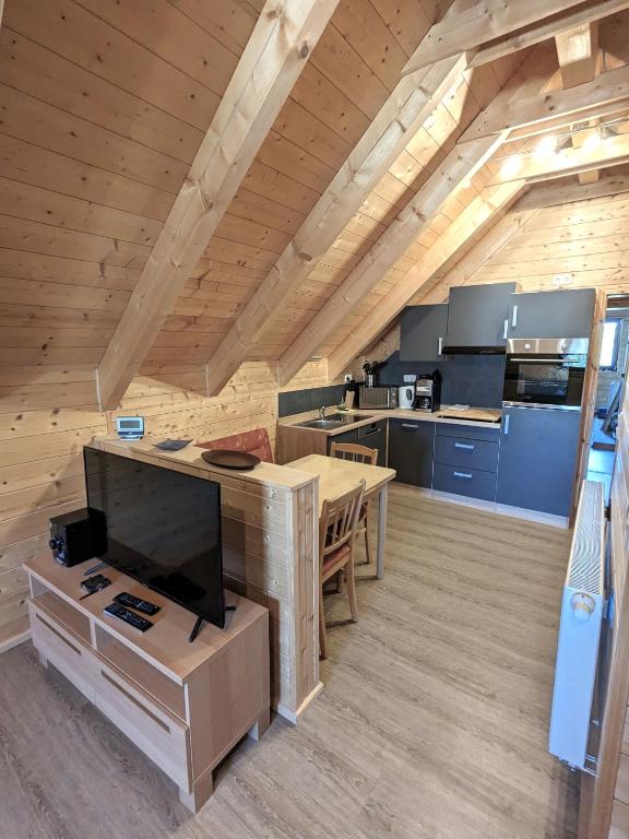 a large kitchen with a table in a room at Studio DG für 1 Person in Kelheim