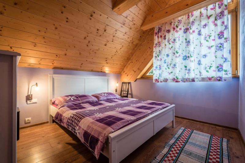 A bed or beds in a room at Chata Havran