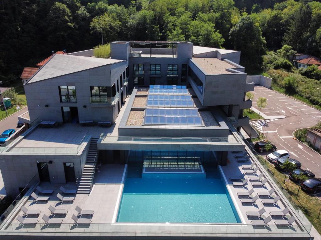 an aerial view of a house with a swimming pool at Terme BANJA LUKA in Banja Luka