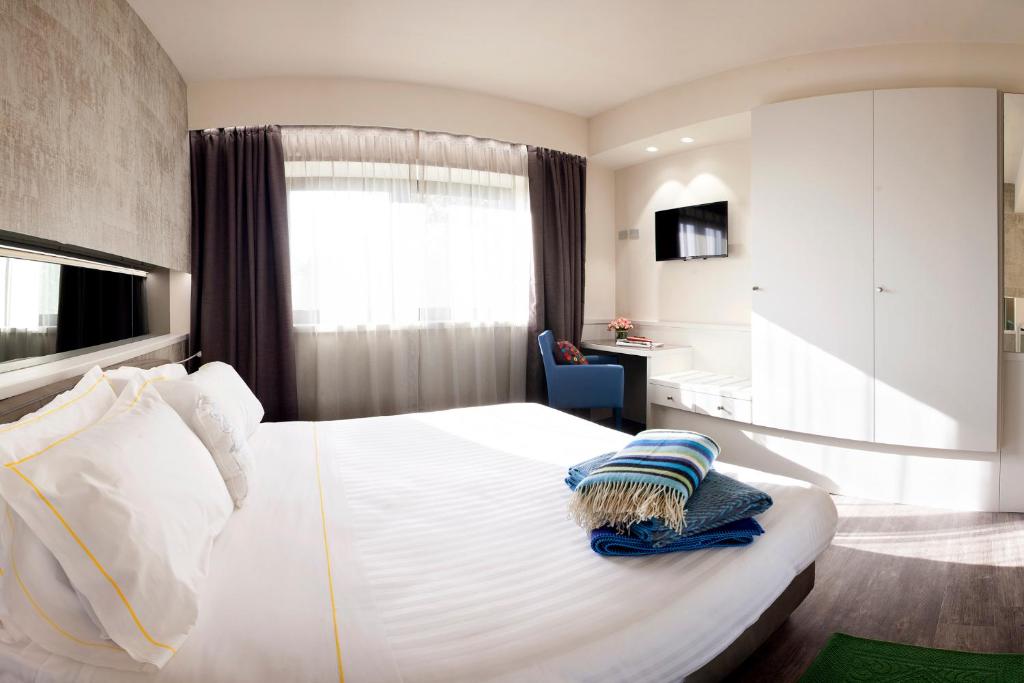 Postel nebo postele na pokoji v ubytování Albavilla Hotel & Co
