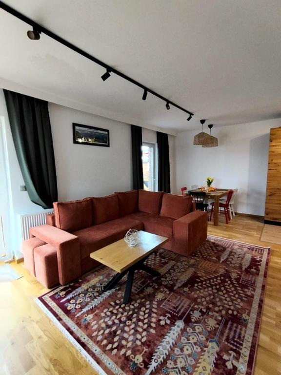 a living room with a couch and a table at Chata na Psiaku in Wrocław